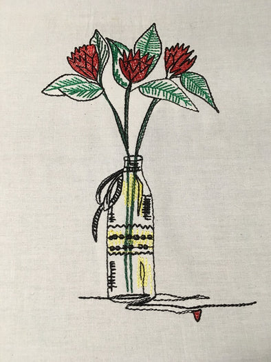 Red Summer flowers in a bottle